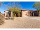 Single-story house with desert landscaping and a two-car garage at 17528 W East Wind Ave, Goodyear, AZ 85338