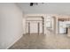 Open living space with built-in shelving and views into the kitchen at 17528 W East Wind Ave, Goodyear, AZ 85338