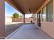 Covered patio with ceiling fan, access to backyard at 17528 W East Wind Ave, Goodyear, AZ 85338