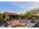 Backyard patio with fire pit and comfortable seating area at 17716 E Silver Sage Ln, Rio Verde, AZ 85263