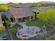 Landscaped backyard with fire pit and putting green at 17716 E Silver Sage Ln, Rio Verde, AZ 85263