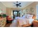 Main bedroom with wood furnishings and sliding glass doors to patio at 17716 E Silver Sage Ln, Rio Verde, AZ 85263