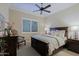 Guest bedroom with wood bed frame and plantation shutters at 17716 E Silver Sage Ln, Rio Verde, AZ 85263