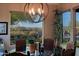 Casual dining area with glass top table and mountain views at 17716 E Silver Sage Ln, Rio Verde, AZ 85263