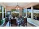 Bright dining room with glass table and mountain views at 17716 E Silver Sage Ln, Rio Verde, AZ 85263