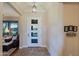 Bright and airy entryway with a modern door and tiled floors at 17716 E Silver Sage Ln, Rio Verde, AZ 85263