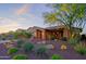 Stunning desert landscape surrounds this single-story home with a welcoming front porch at 17716 E Silver Sage Ln, Rio Verde, AZ 85263