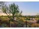 Scenic view of a golf course from behind a fence at 17716 E Silver Sage Ln, Rio Verde, AZ 85263