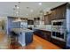 Elegant kitchen with dark wood cabinets and granite countertops at 17716 E Silver Sage Ln, Rio Verde, AZ 85263