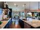 Modern kitchen with dark cabinetry, granite counters and island at 17716 E Silver Sage Ln, Rio Verde, AZ 85263