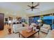 Bright and airy living room with views of the kitchen and backyard at 17716 E Silver Sage Ln, Rio Verde, AZ 85263