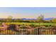 Scenic view of a golf course and mountain range at 17716 E Silver Sage Ln, Rio Verde, AZ 85263