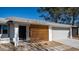 Front view of house showcasing modern wooden entryway at 1834 W Kerry Ln, Phoenix, AZ 85027