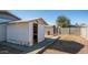 White storage shed in backyard with a small walkway at 1834 W Kerry Ln, Phoenix, AZ 85027