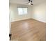 Spacious bedroom featuring light wood flooring and a ceiling fan at 1936 E Cornell Dr, Tempe, AZ 85283