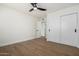 Spacious bedroom with wood floors, ceiling fan and sliding door closet at 1936 E Cornell Dr, Tempe, AZ 85283