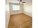 Well-lit bedroom, featuring wood-look flooring and window coverings at 1936 E Cornell Dr, Tempe, AZ 85283