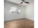 Well-lit bedroom with wood floors and window blinds at 1936 E Cornell Dr, Tempe, AZ 85283