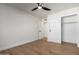 Spacious bedroom with wood floors, ceiling fan, and closet at 1936 E Cornell Dr, Tempe, AZ 85283