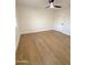 Spacious bedroom featuring light hardwood flooring and ceiling fan at 1936 E Cornell Dr, Tempe, AZ 85283