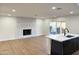 Living room features a white brick fireplace and hardwood floors at 1936 E Cornell Dr, Tempe, AZ 85283