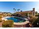 Inviting kidney-shaped pool surrounded by lush landscaping at 1936 E Cornell Dr, Tempe, AZ 85283