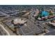 Aerial view of community features including clubhouse, pool, and tennis courts at 19847 N 108Th Ave, Peoria, AZ 85373