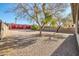 Landscaped backyard with gravel and mature trees at 19847 N 108Th Ave, Peoria, AZ 85373