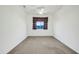 Bedroom with carpet, window, and ceiling fan at 19847 N 108Th Ave, Peoria, AZ 85373