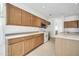 Kitchen with light wood cabinets, tile floor, and island at 19847 N 108Th Ave, Peoria, AZ 85373