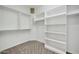 Spacious walk-in closet with shelving and hanging rods at 19847 N 108Th Ave, Peoria, AZ 85373