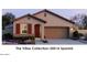 Spanish style home with red accents and a two-car garage at 22319 W Monona Ln, Surprise, AZ 85387