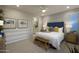 Main bedroom with a navy headboard and neutral-toned bedding at 20753 N 223Rd Dr, Surprise, AZ 85387