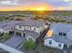 Luxury two-story home with landscaped yard, pool, and mountain views at sunset at 22034 N 59Th Pl, Phoenix, AZ 85054