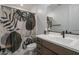 Clean bathroom with single vanity and shower/tub combo at 22034 N 59Th Pl, Phoenix, AZ 85054