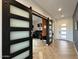 Modern entryway with barn doors opening to an office at 22034 N 59Th Pl, Phoenix, AZ 85054