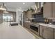 Modern kitchen with stainless steel appliances and large island at 22034 N 59Th Pl, Phoenix, AZ 85054