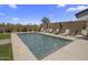 Inviting rectangular pool with lounge chairs in a sunny backyard at 22034 N 59Th Pl, Phoenix, AZ 85054