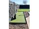 Putting green with artificial turf and modern landscaping at 22233 N 76Th Dr, Peoria, AZ 85383