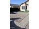 Landscaped backyard with brick pavers and gravel at 22233 N 76Th Dr, Peoria, AZ 85383