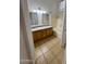 Spacious bathroom features a double sink vanity with granite countertops and a shower-tub combination at 22233 N 76Th Dr, Peoria, AZ 85383