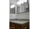 Bathroom boasts granite countertop and large mirror at 22233 N 76Th Dr, Peoria, AZ 85383