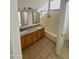 Bathroom boasts double sinks, granite countertop, and bathtub at 22233 N 76Th Dr, Peoria, AZ 85383