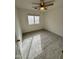 Cozy bedroom with neutral carpet, a ceiling fan, and a window view at 22233 N 76Th Dr, Peoria, AZ 85383