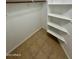 Spacious closet with built-in shelves and hanging rod at 22233 N 76Th Dr, Peoria, AZ 85383