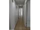 Long hallway with tile flooring and access to bedrooms at 22233 N 76Th Dr, Peoria, AZ 85383