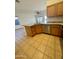 Kitchen island with granite countertop and stainless steel dishwasher at 22233 N 76Th Dr, Peoria, AZ 85383