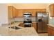 Kitchen with stainless steel appliances and granite counters at 22233 N 76Th Dr, Peoria, AZ 85383