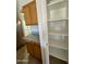 Kitchen pantry with wood cabinets and ample shelving at 22233 N 76Th Dr, Peoria, AZ 85383