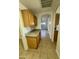 Additional kitchen counter space with wood cabinets and granite countertop at 22233 N 76Th Dr, Peoria, AZ 85383